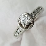 18K	White Gold	Bezel	.5+.65	ct.	R	Cut	Diamond	4-prong	Solitaire with Accents		Engagement-Ring